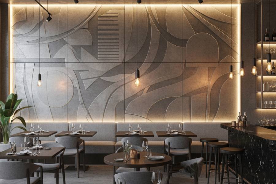 Grabado láser en mural con placas metálicas en un restaurante
